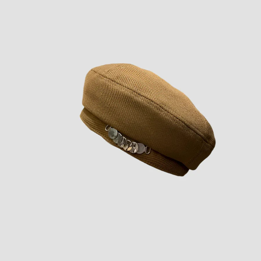 Brown beret with silver embellishments.
