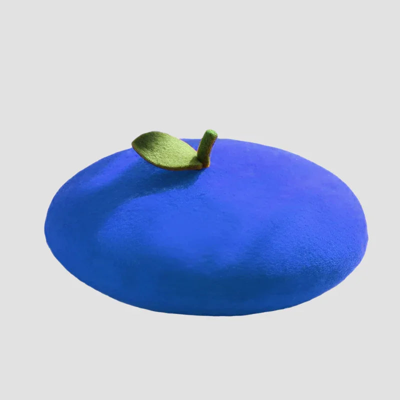 Blue beret with green leaf.