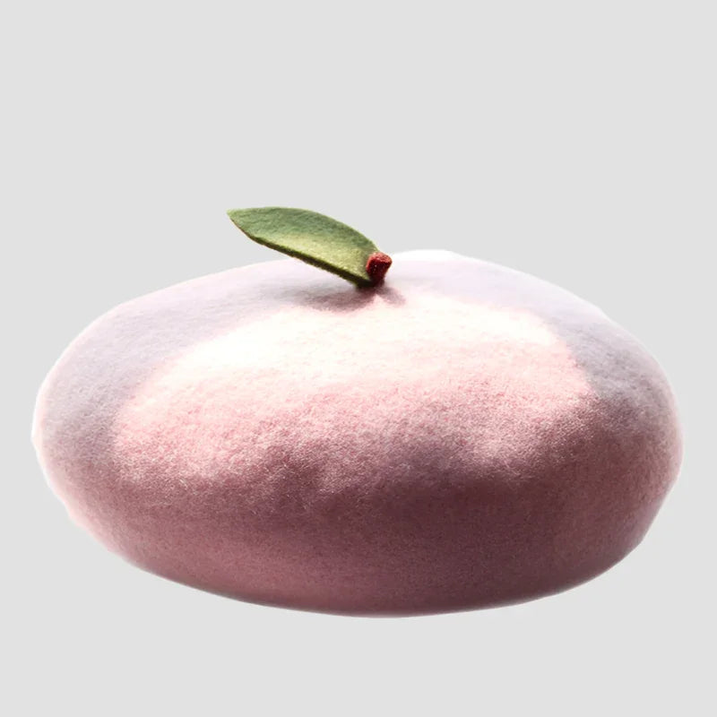 Pink beret with green leaf.