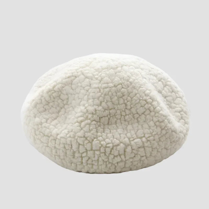 Cream-colored, textured beret.