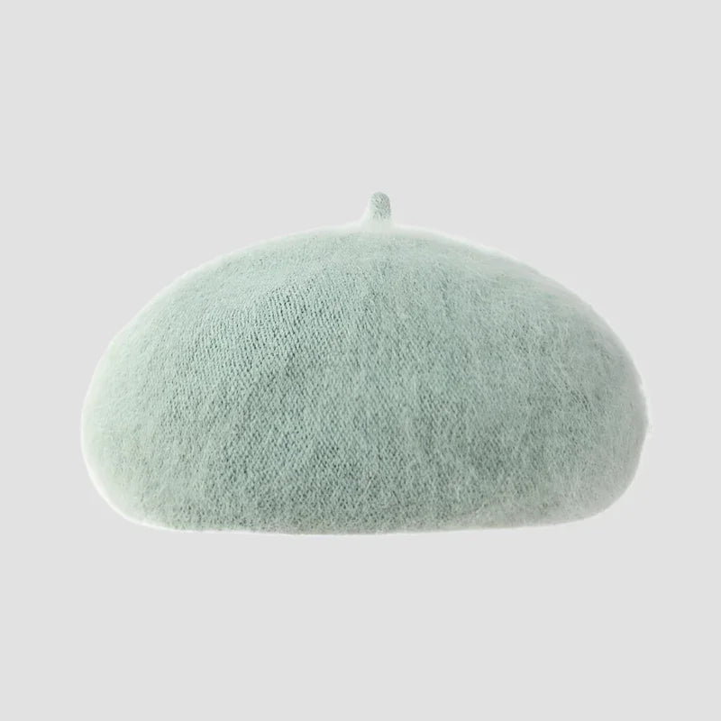 Light green knitted beret.