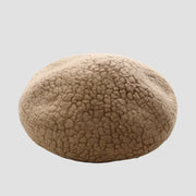 Textured beige beret.
