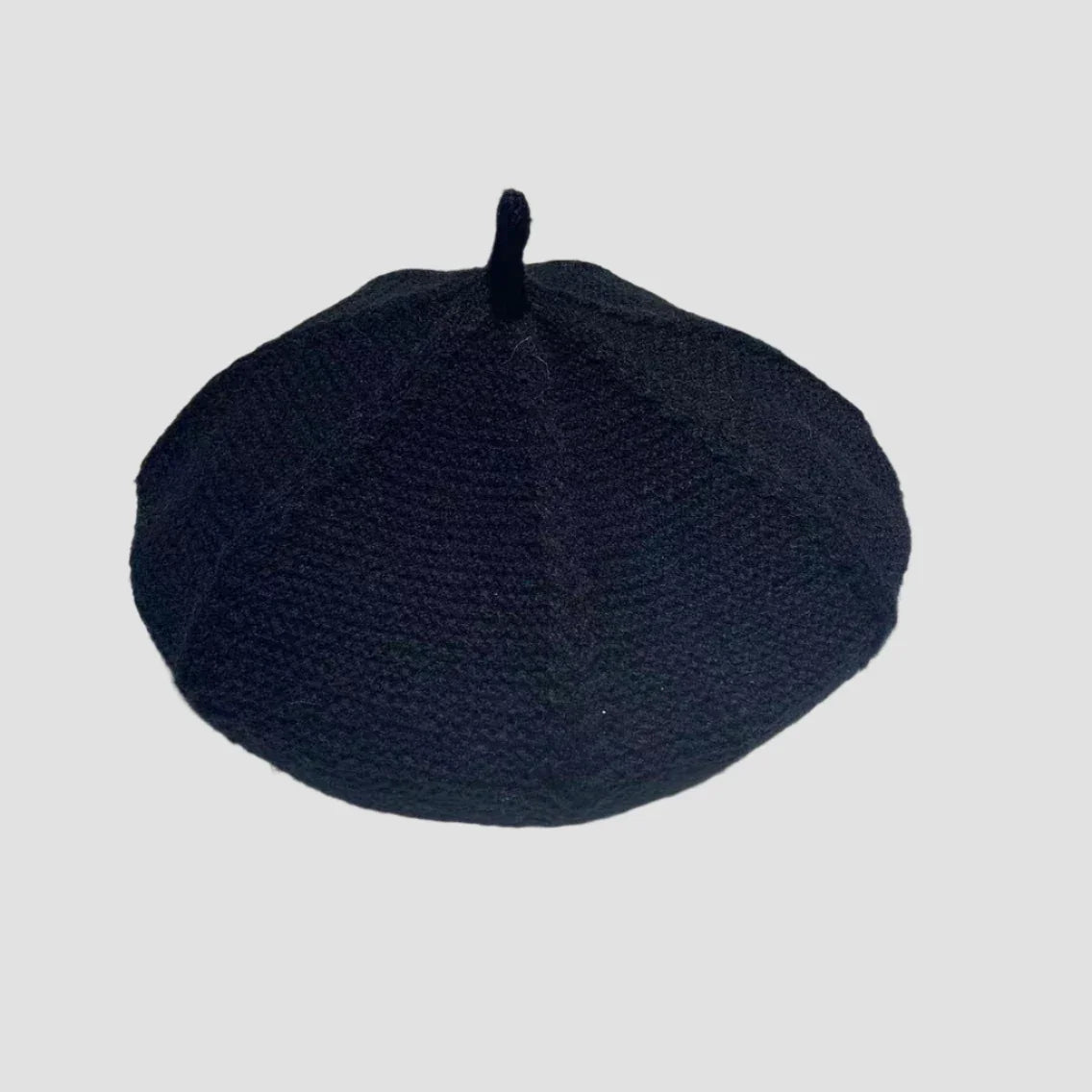 Black knitted beret.