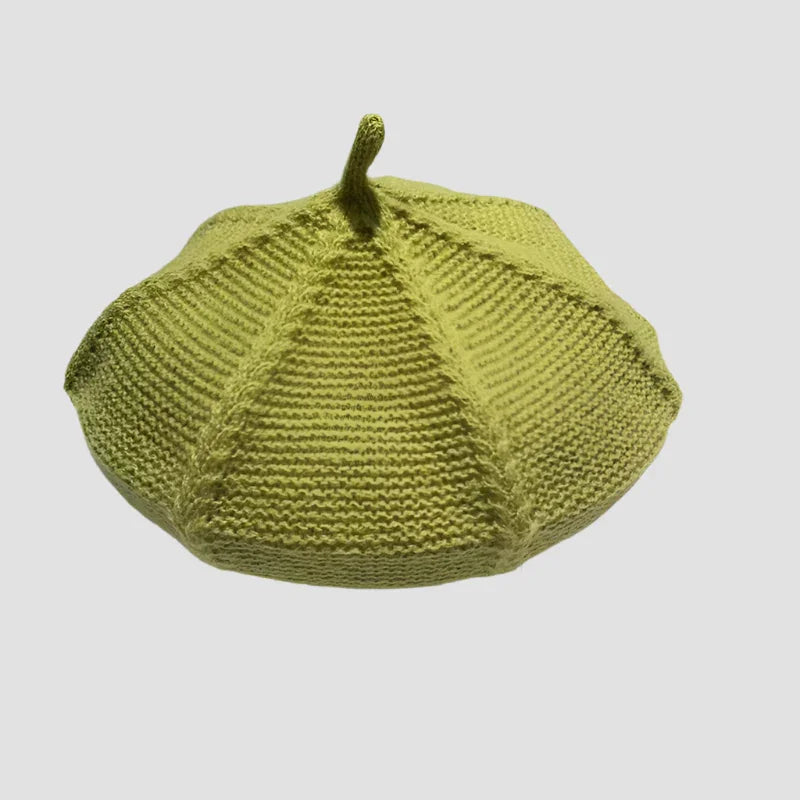 Knitted green pumpkin hat.