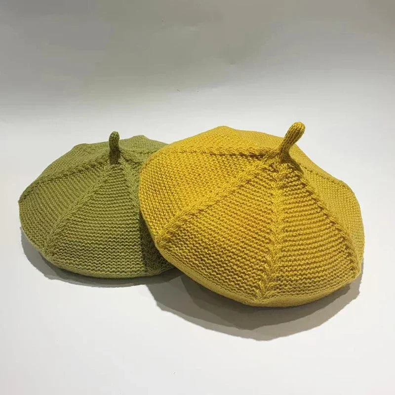 Two knitted berets.