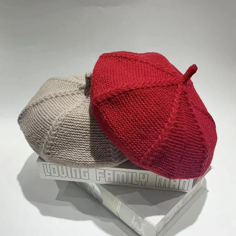Two knitted berets.