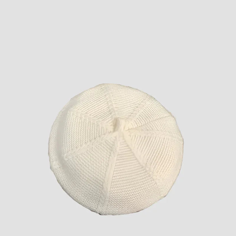 White knitted beanie.