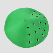 Green beret with eyelets.