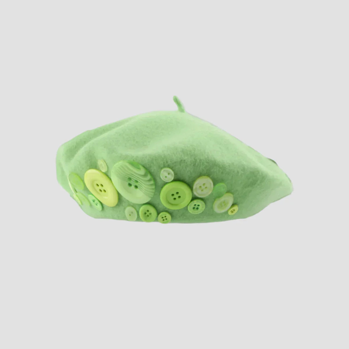 Green beret with buttons.