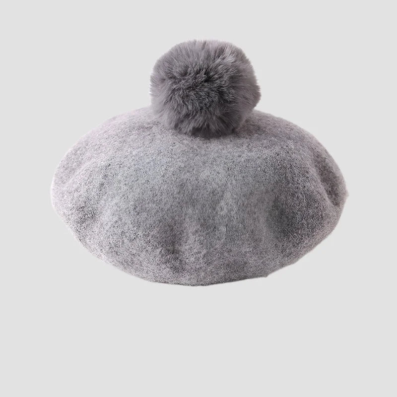 Gray wool beret with pompom.