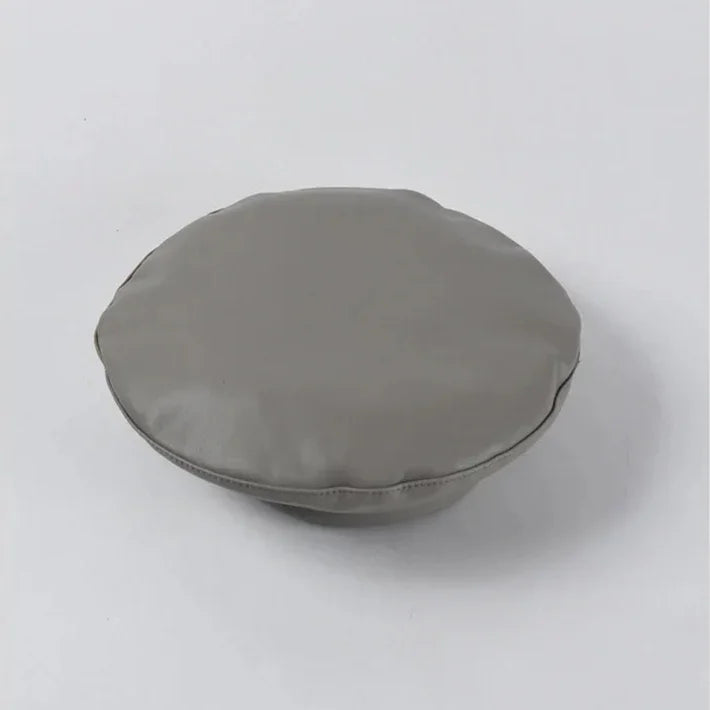 Round gray cushion.