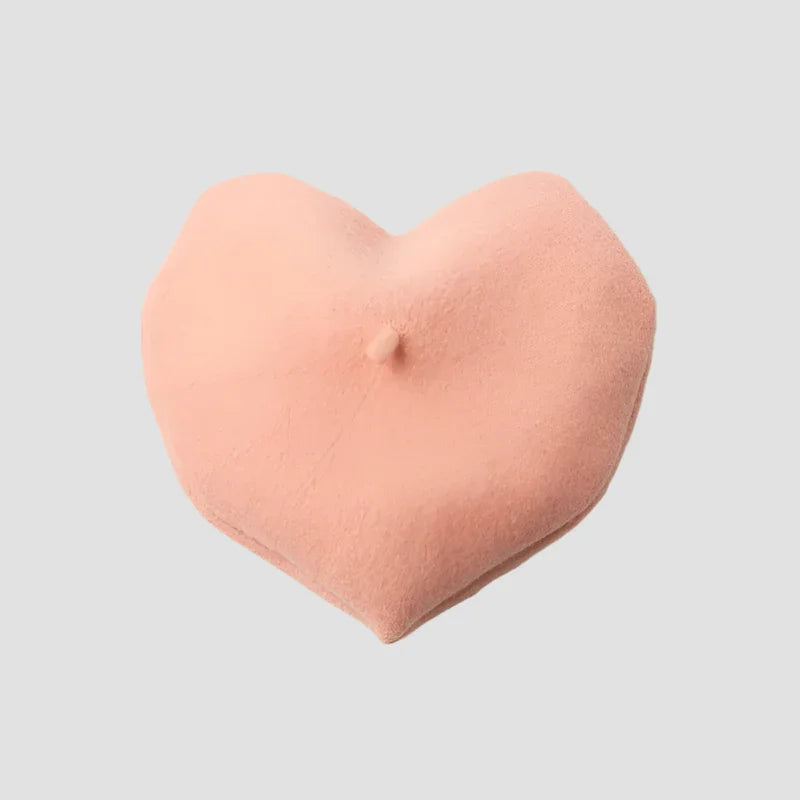 Peach-colored heart-shaped pillow.