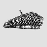 Houndstooth patterned beret.