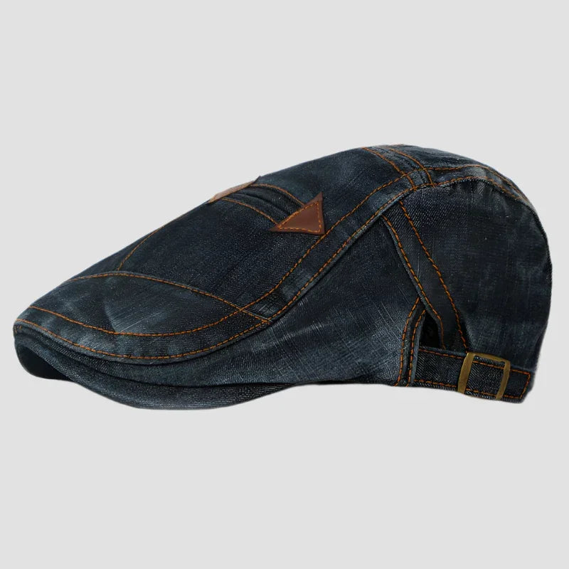Denim flat cap with adjustable strap.