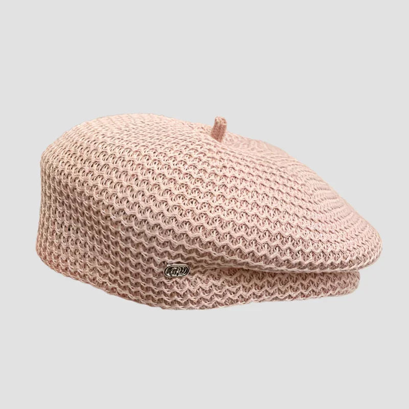 Pink knitted beret.