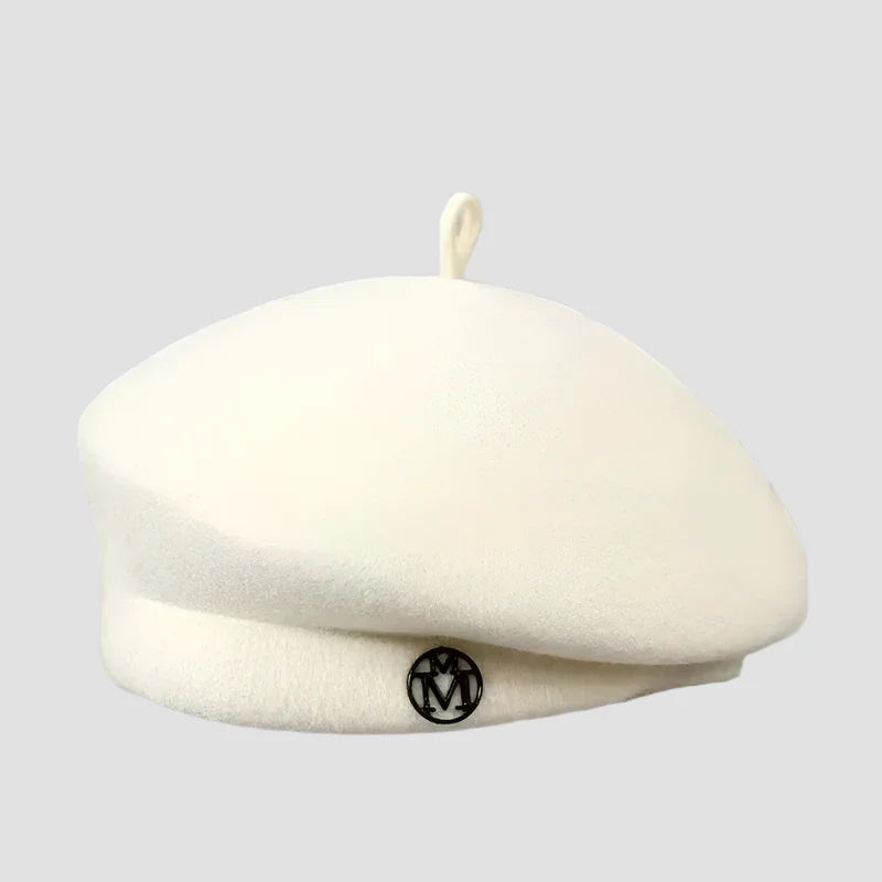 Cream-colored beret with a circular logo.