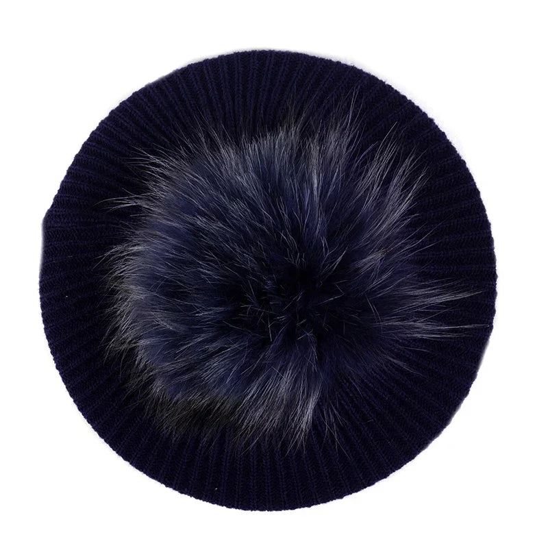Navy knit beret with fur pompom.