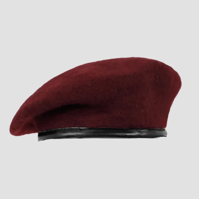 Maroon wool beret with black trim.