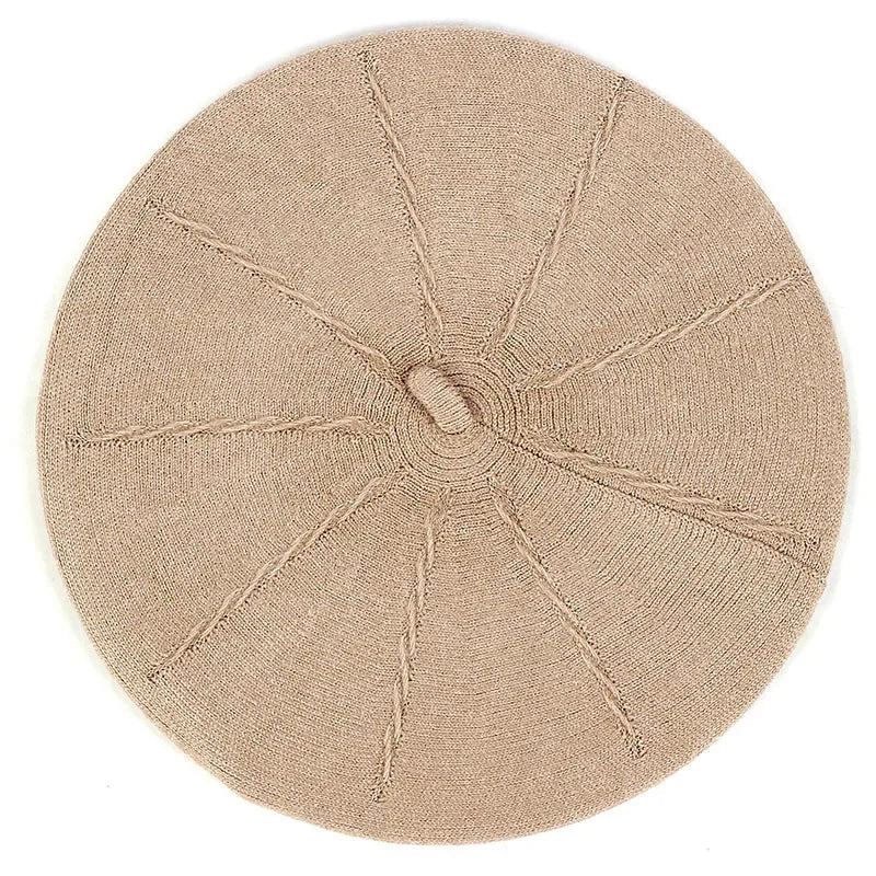 Knitted beige beret.