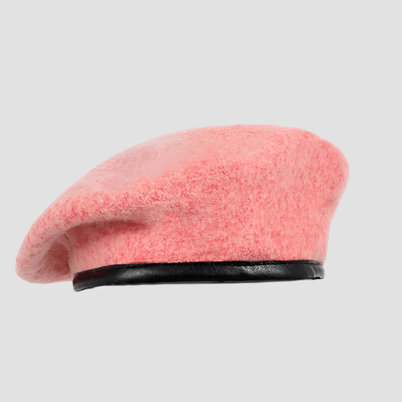 Pink wool beret with black trim.