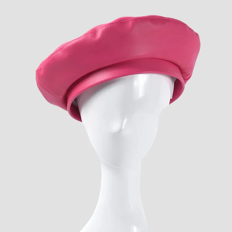 Pink leather beret on mannequin head.