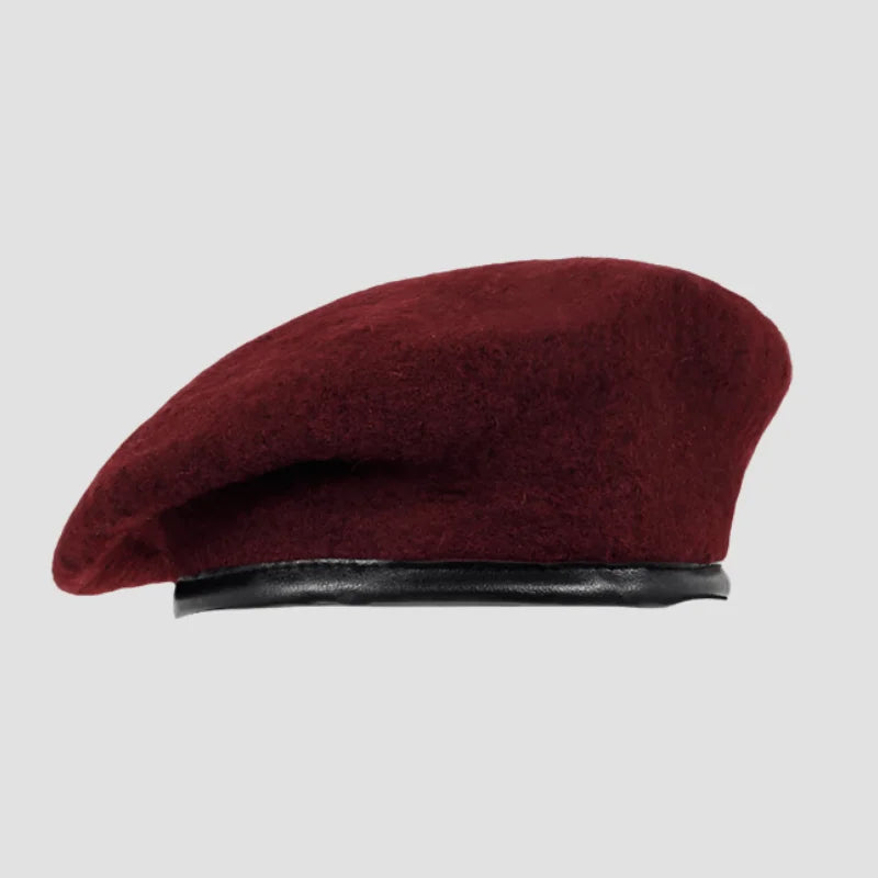 Maroon wool beret with black band.