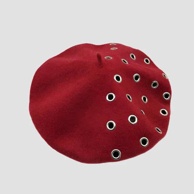 Red beret with grommets.