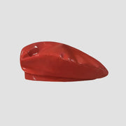 Red patent leather beret.