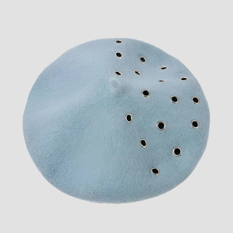 Light blue beret with grommets.