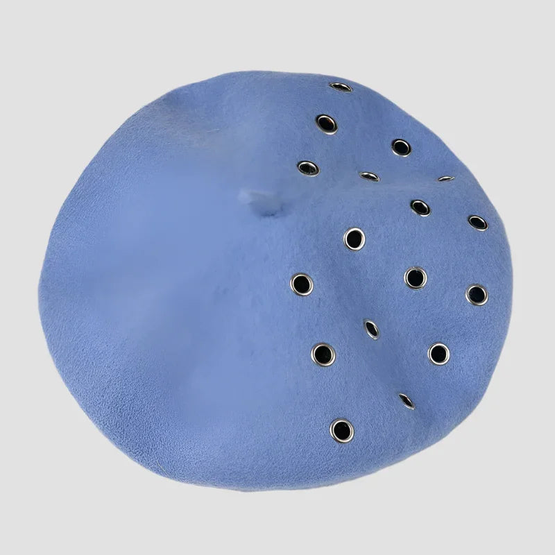 Periwinkle beret with grommets.
