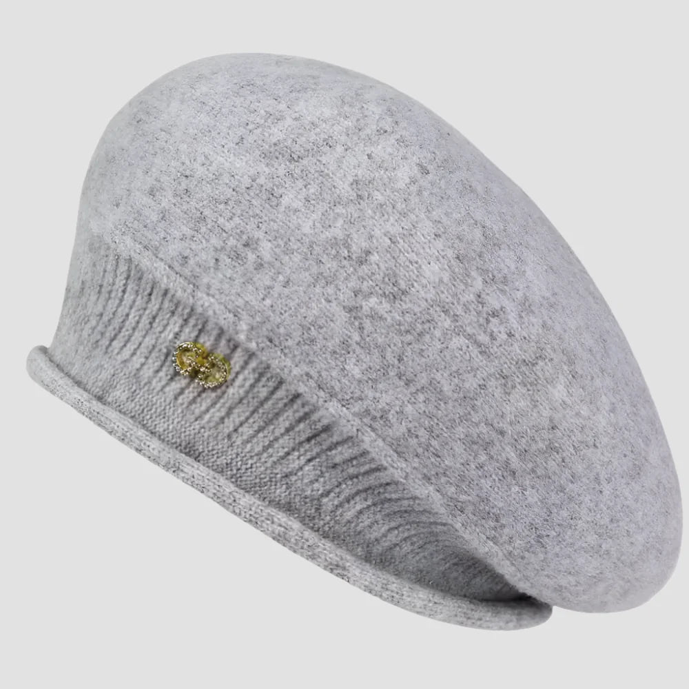 Gray knitted beret with embellishment.