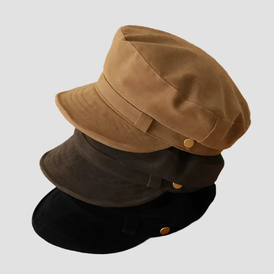 Stacked brown, dark green, and black hats.