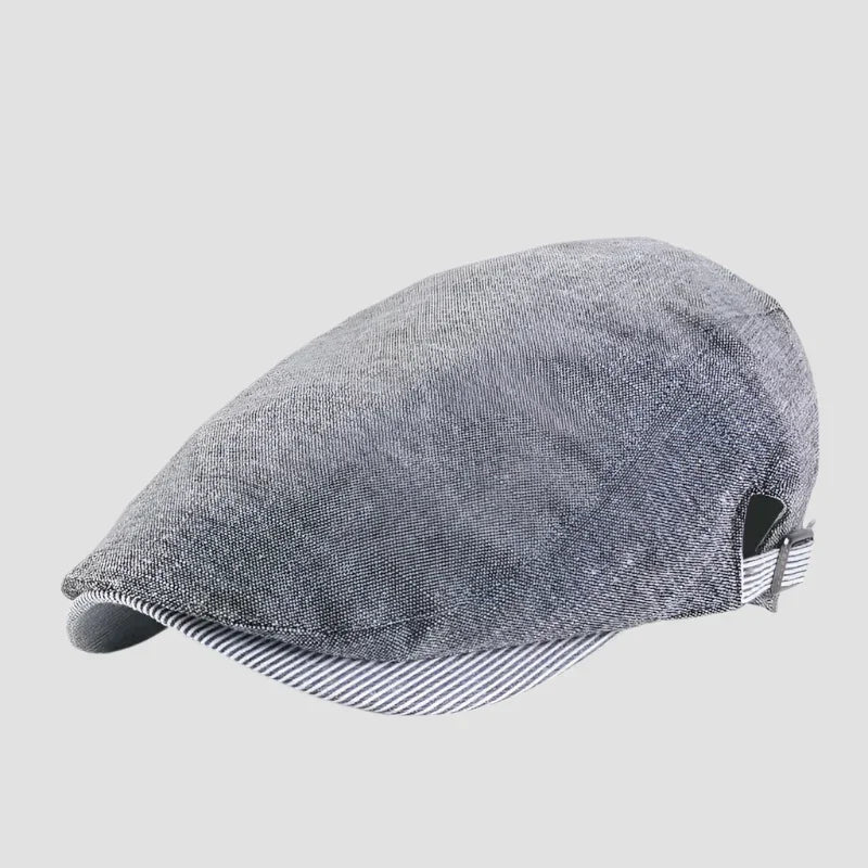 Gray newsboy cap with striped brim.