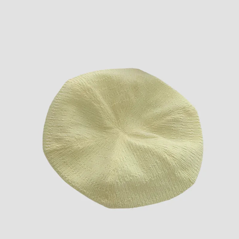 Textured, pale yellow beret.