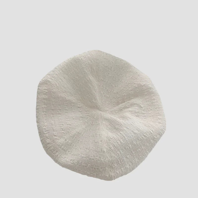Textured white beret.