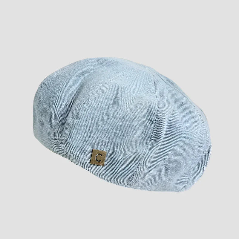 Light blue newsboy cap.