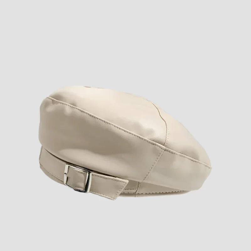 Cream-colored leather beret with buckle.