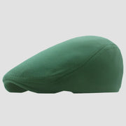 Green flat cap.