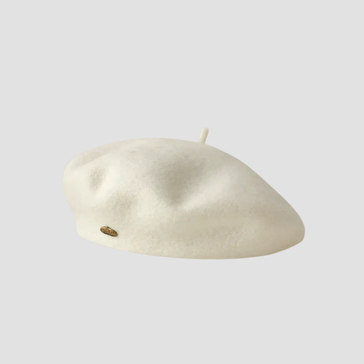 Cream-colored wool beret.
