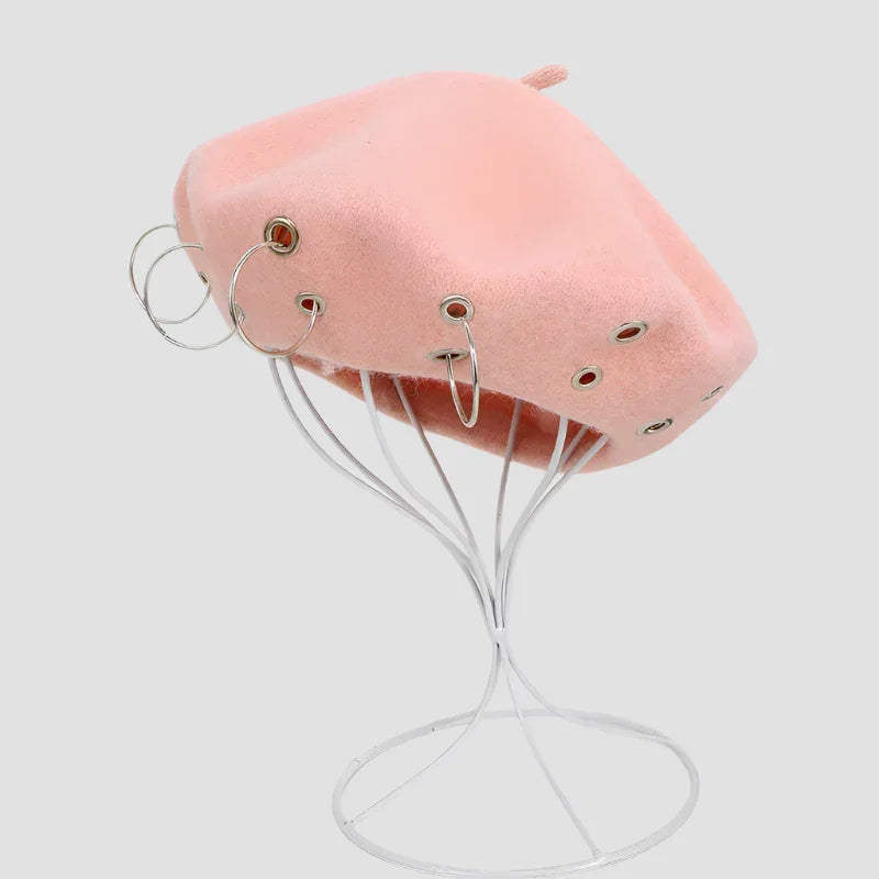 Pink beret with silver hoops.