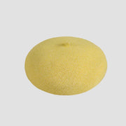 Round, yellow, textured beret.