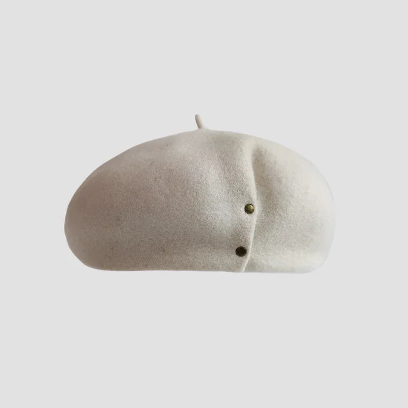 Cream-colored beret with two buttons.
