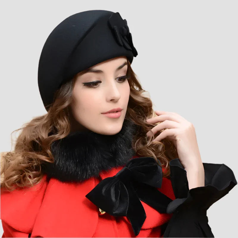 Woman’s black hat with flower detail.