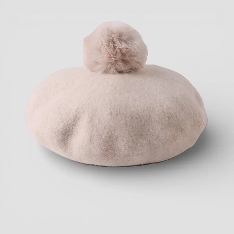Soft blush pink felt beret with fluffy pom-pom top