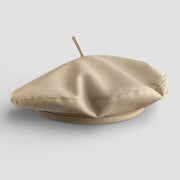 Beige leather French beret with central button