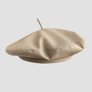 Beige leather beret.