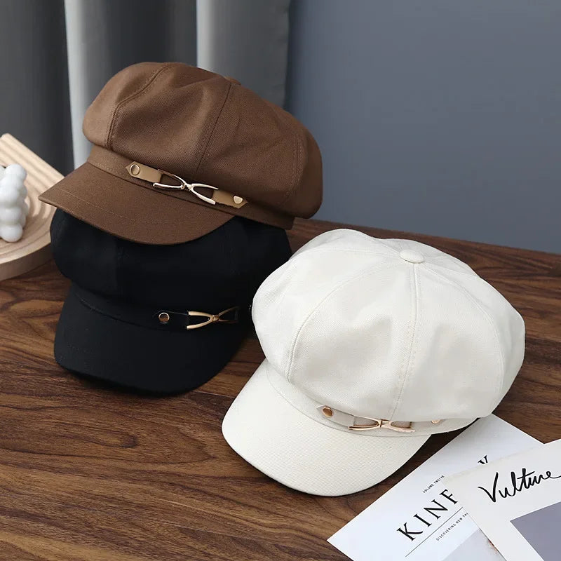 Stack of stylish newsboy caps.