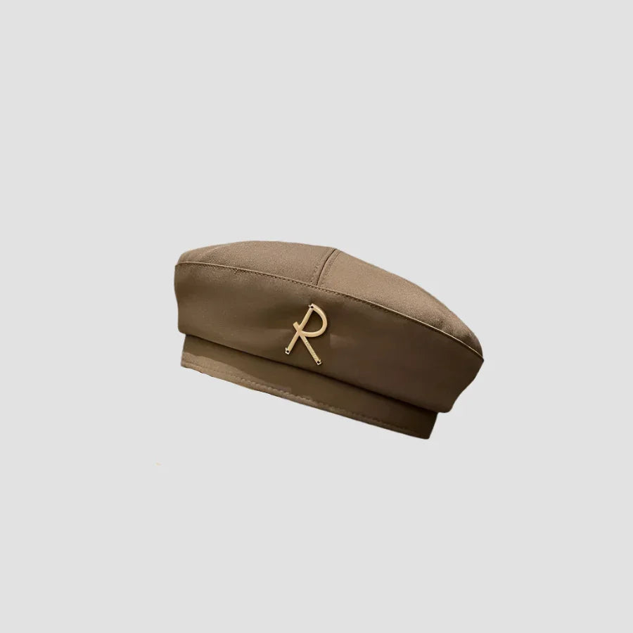 Brown beret with gold ’R’ accent.