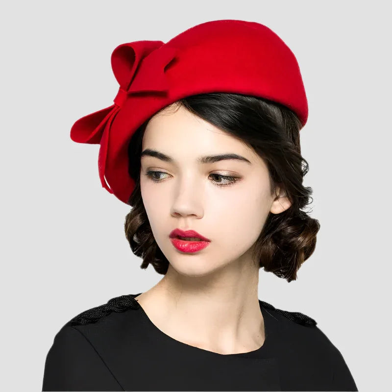 Red wool hat with bow.