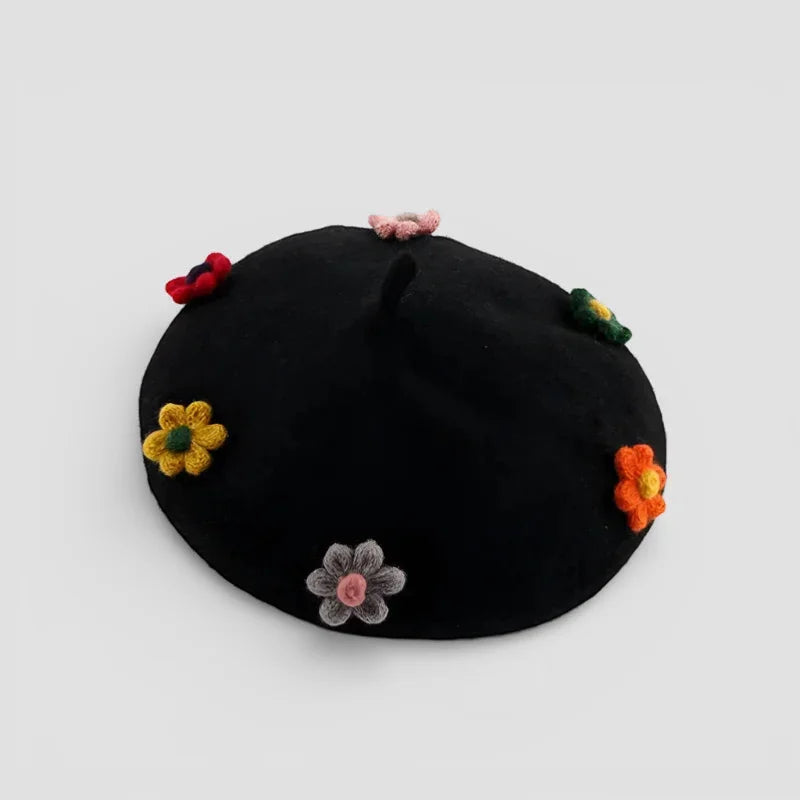 Black velvet beret with colorful crocheted flowers in yellow orange pink green